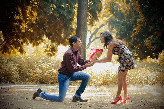 Happy young beautiful loving couple posing walking outdoors in park nature  take selfie by mobile phone kissing. Stock Photo by ©Vadymvdrobot 285890498