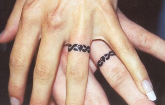 20 Unique Wedding Ring Tattoo Ideas to Inspire Your Own | Tattoo wedding  rings, Wedding band tattoo, Ring tattoos